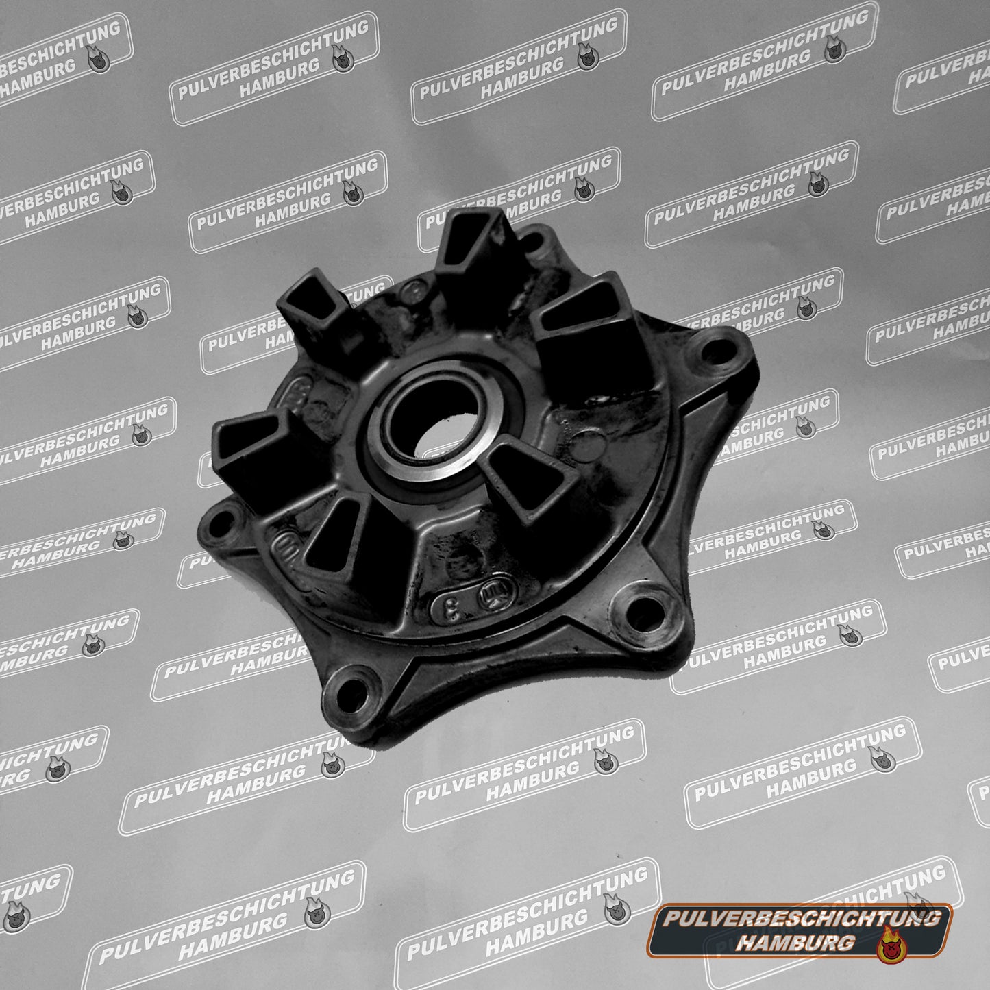 Motorcycle sprocket carrier powder coating